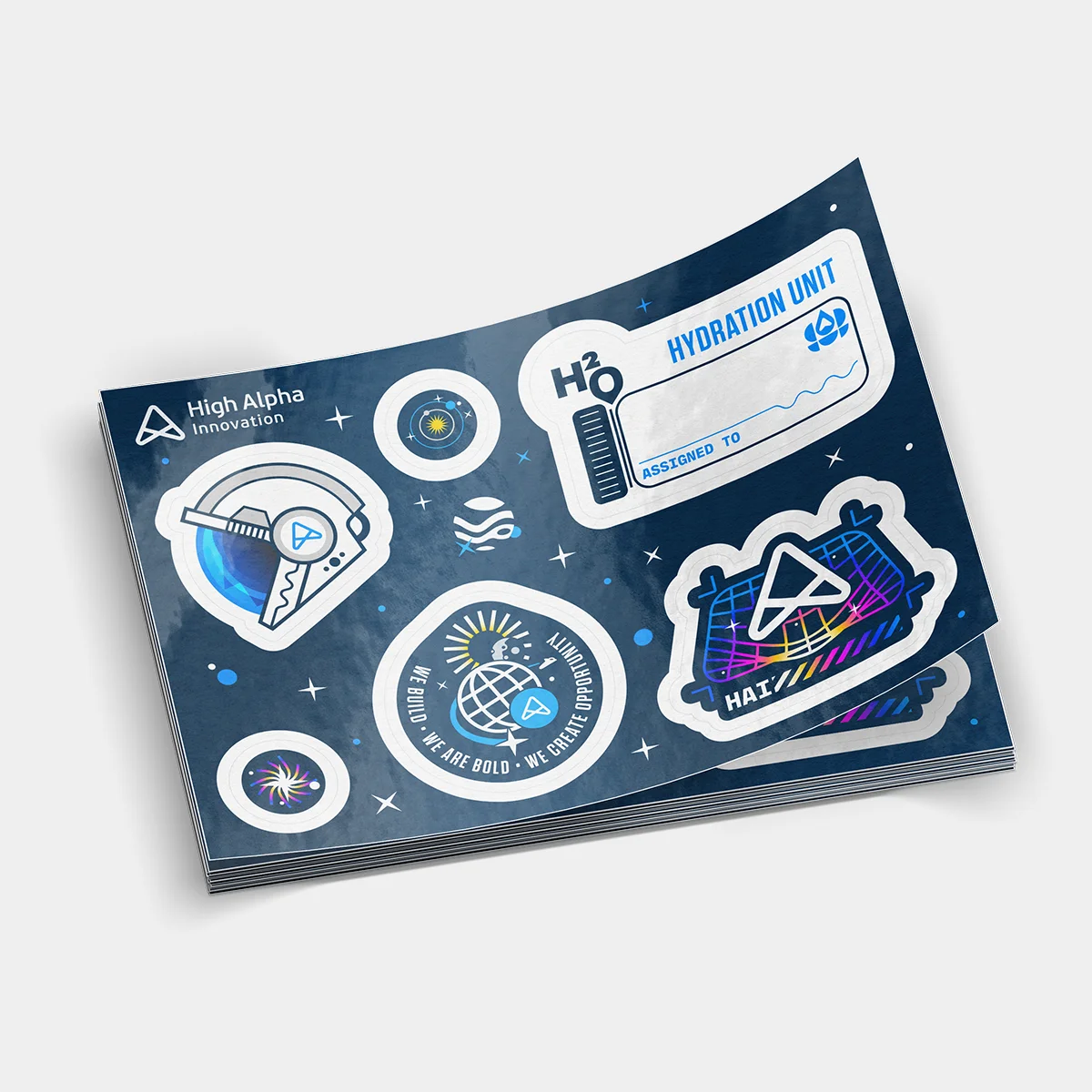 Photograph of a stack of stickersheets with space themed stickers